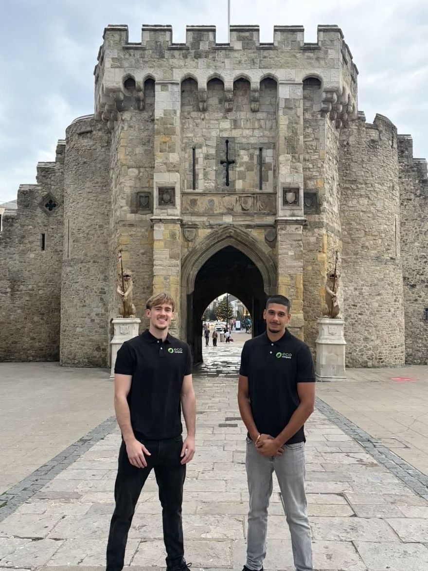Rishi and Adam, co-founders of EcoCompare, in branded polo shirts outside the Bargate in Southampton